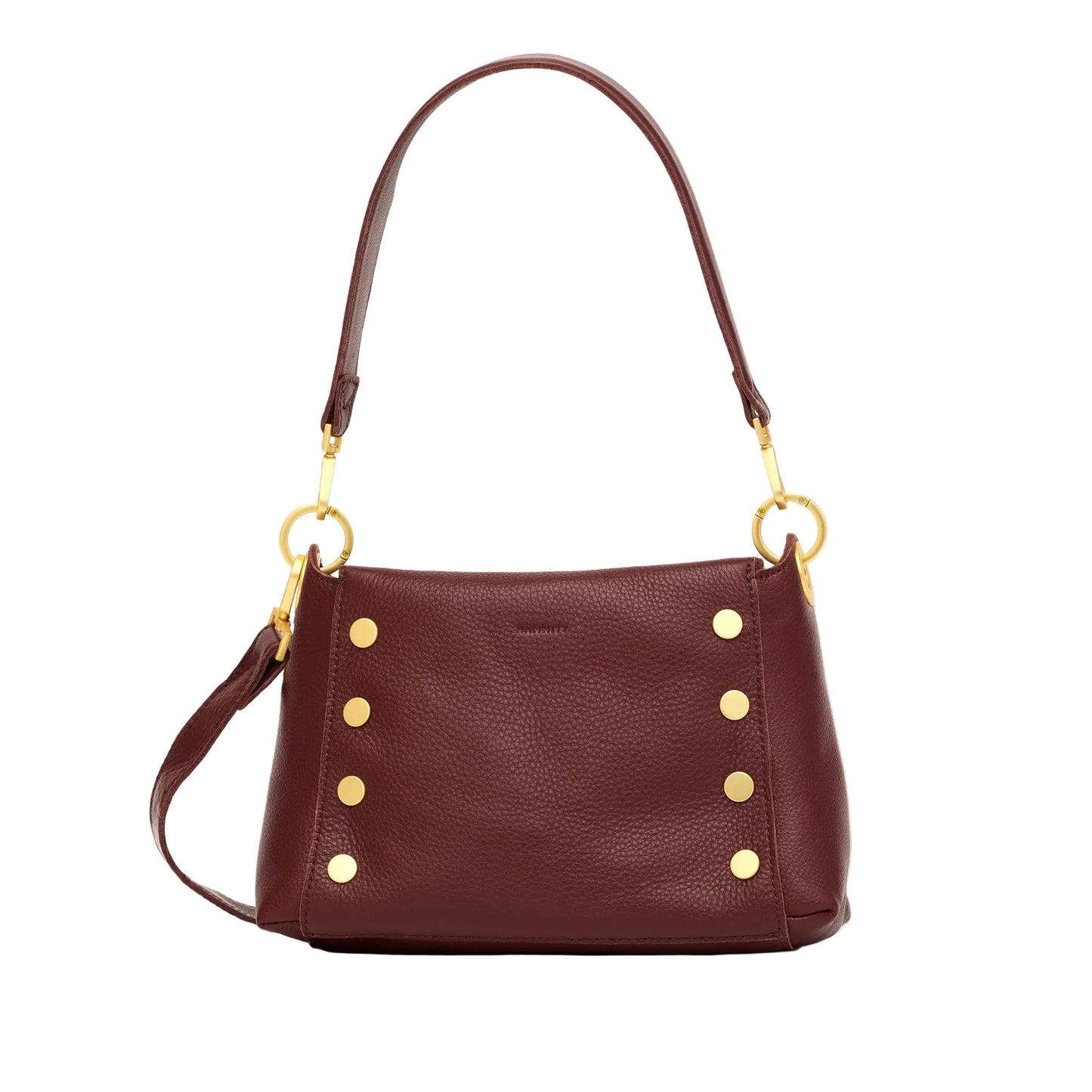 Burgundy leather handbag with gold buttons and a strap on a white background
