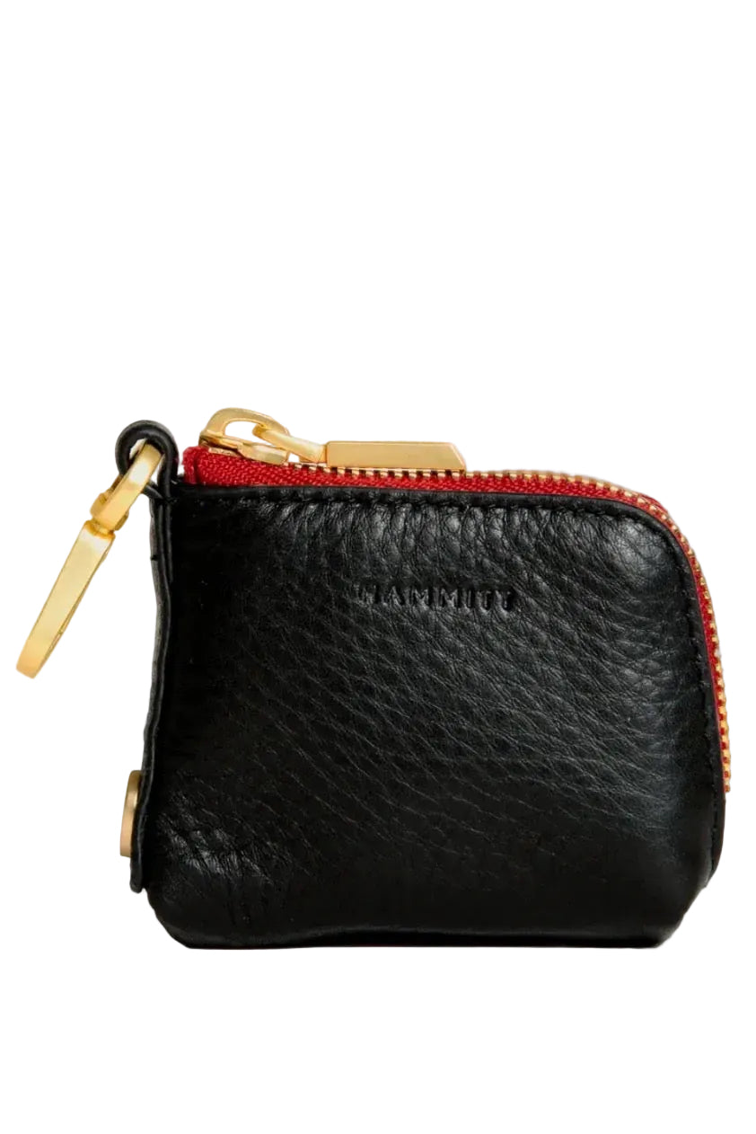 Black leather coin purse with red interior zipper on a white background, featuring the HAMMITT brand.