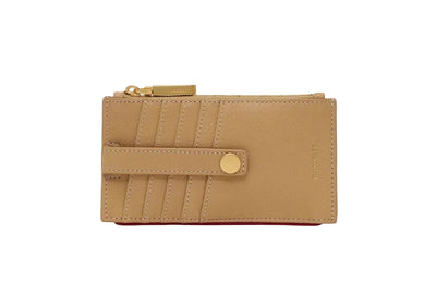 Beige wallet with a gold zipper and button on a white background