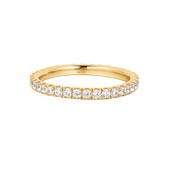 Gold ring with diamonds on a white background
