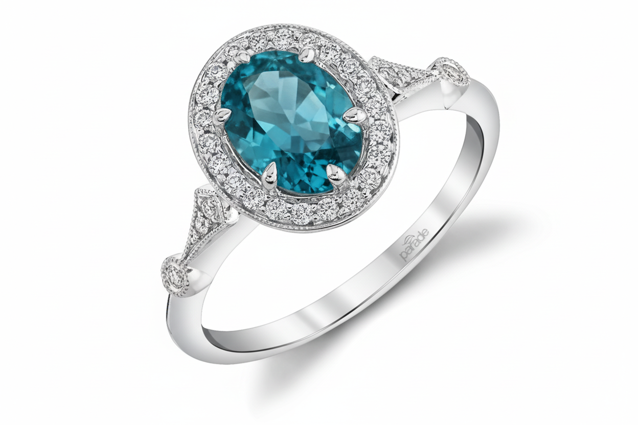 Gold ring with a blue gemstone and diamond accents on a white background