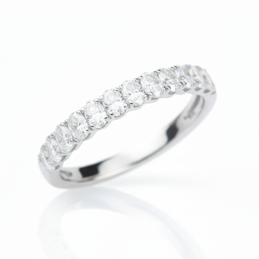 Silver ring with diamonds on a light background