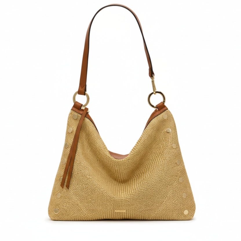 Beige woven handbag with brown leather straps on a white background