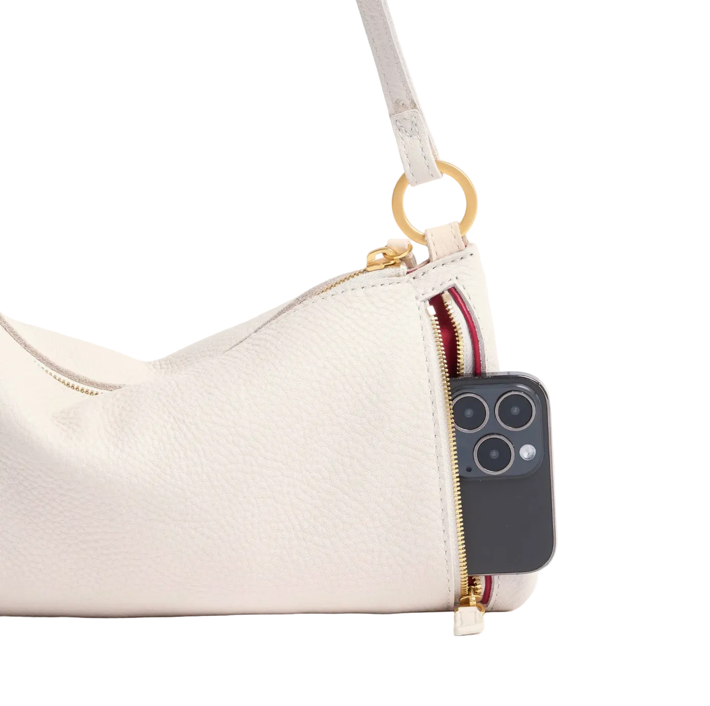 White handbag with a phone case attached to a strap on a white background