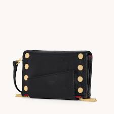 Levy Crossbody Purse in Black/Brushed Gold with a Red Zip