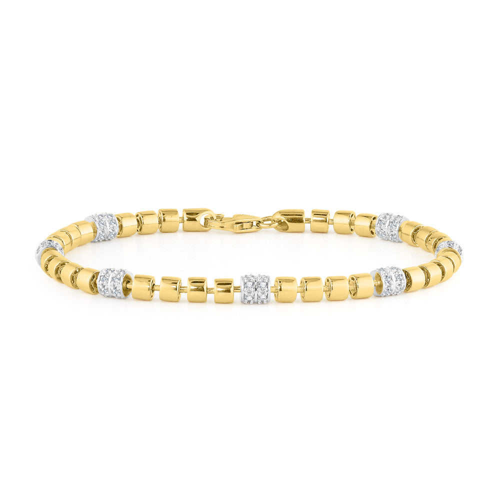 Gold bracelet with embedded diamonds on a white background