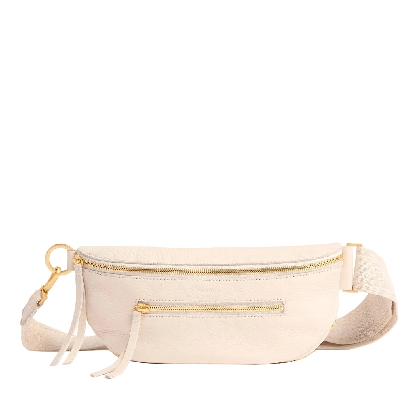 Cream fanny pack with gold zippers on a white background