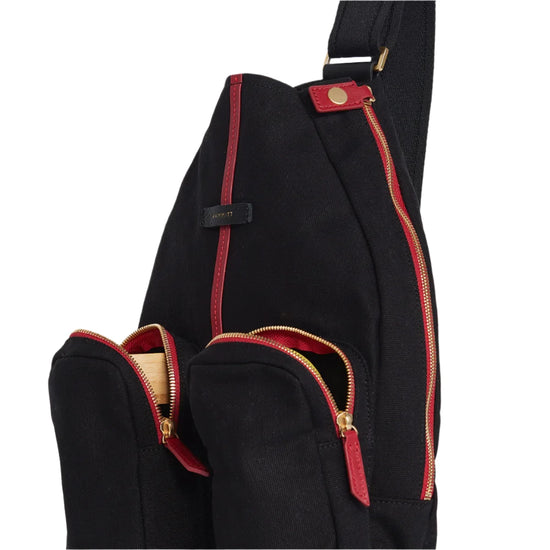 COURTSIDE SLING in Black/ Gold with Red Zip