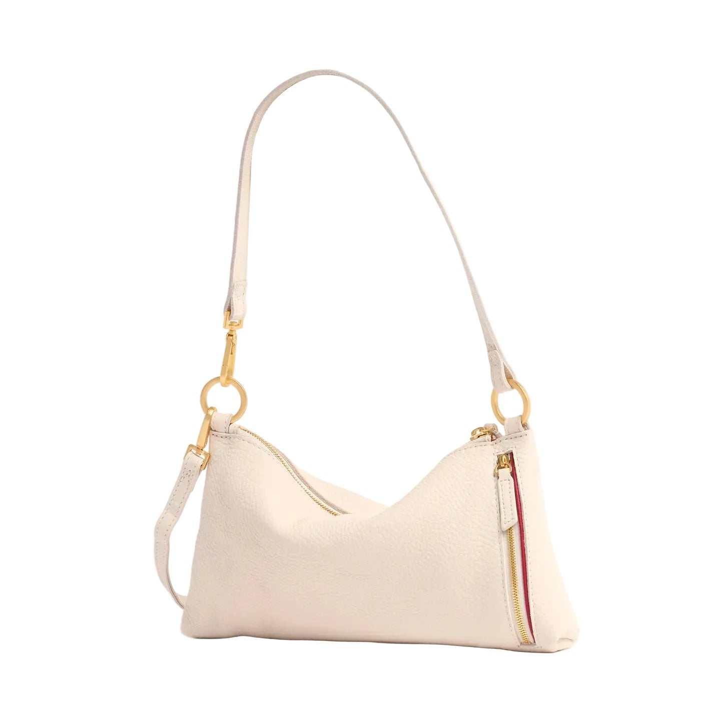Rear view of cream handbag with gold accents on a white background