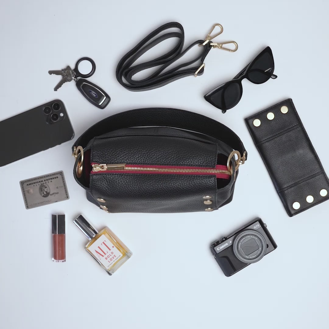 Load and play video in Gallery viewer, Bryant Med Handbag in Black/ Brushed gold with Red Zip
