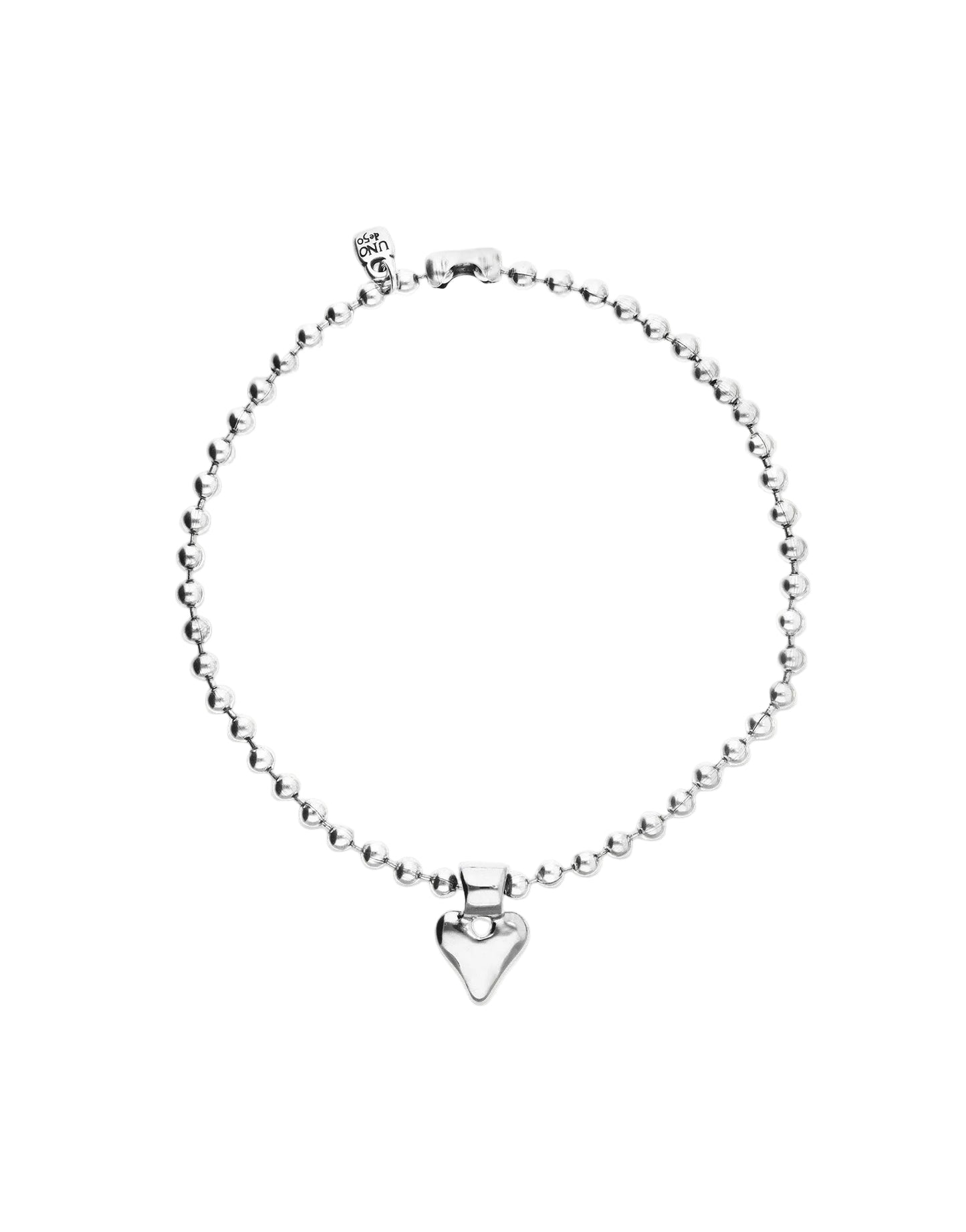 Silver necklace with a heart-shaped charm on a white background